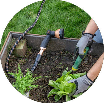 The Copper Bullet and 10-Pattern Nozzle in use while gardening