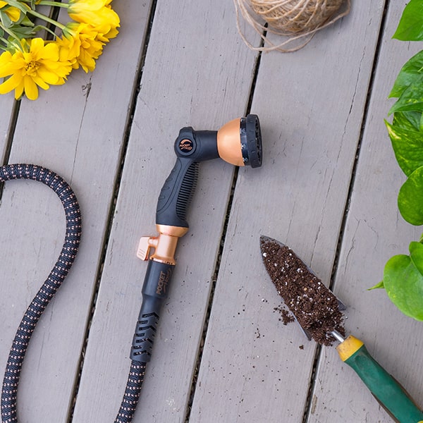 Copper Bullet 10-Pattern Sprayer on a wooden deck