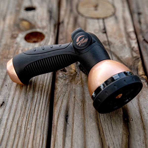 Copper Bullet 10-Pattern Sprayer closeup on a wooden deck