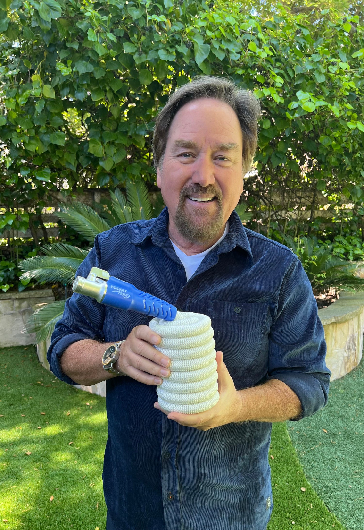 Richard Karn holding the Marine Hose