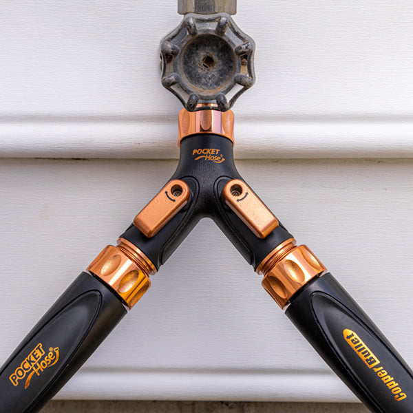 Copper Bullet 2-Way Hose Splitter installed on spigot