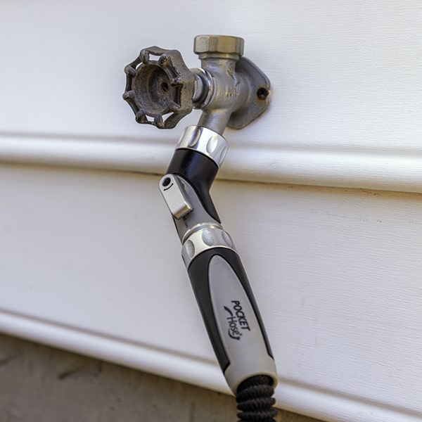 Silver Bullet Elbow Connector installed at a side angle with Silver Bullet hose attached
