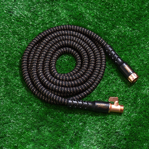 Pocket Hose Copper Bullet compactly coiled on lawn